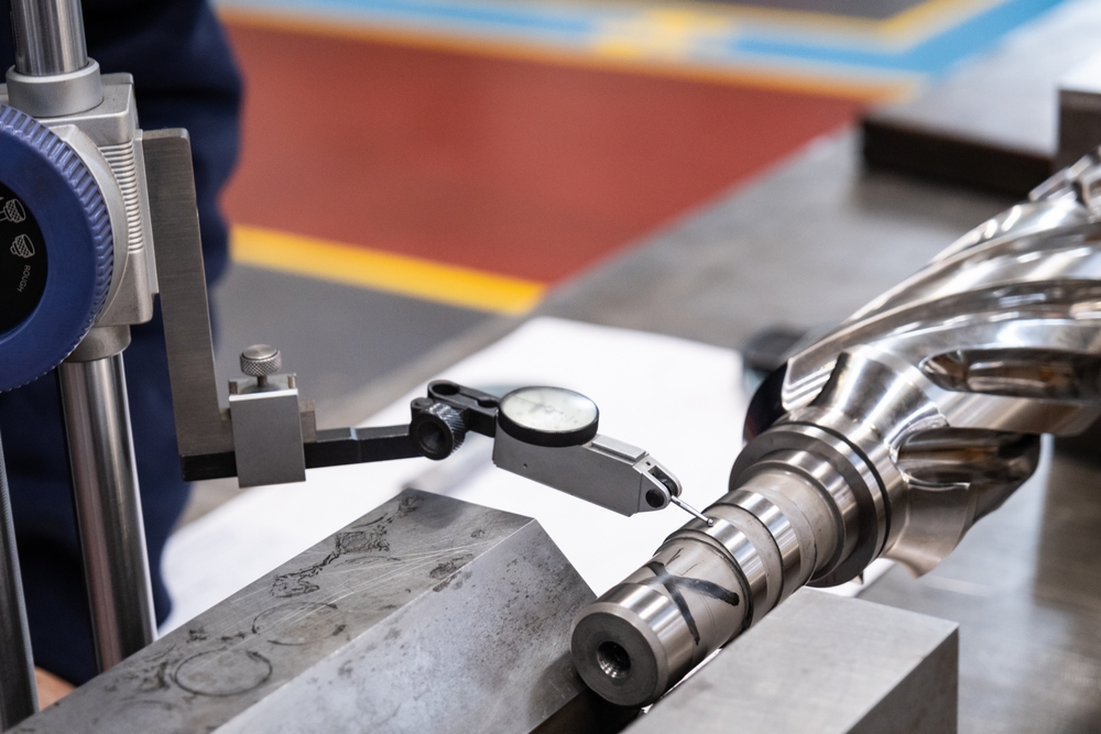 Professional quality control inspector conduct safety inspection on steel machinery and manufacturing process.